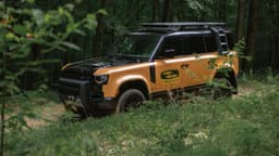 Land Rover Defender Trophy Edition Side In Grass Land Rover Defender Trophy Edition Side In Grass